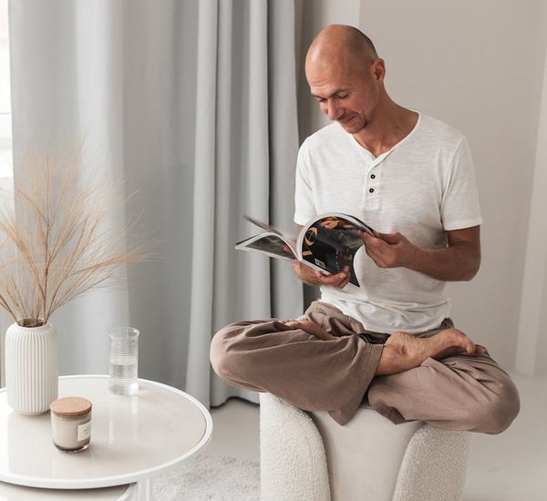 A calm room setup for yoga with a mat, water bottle, and soft light.